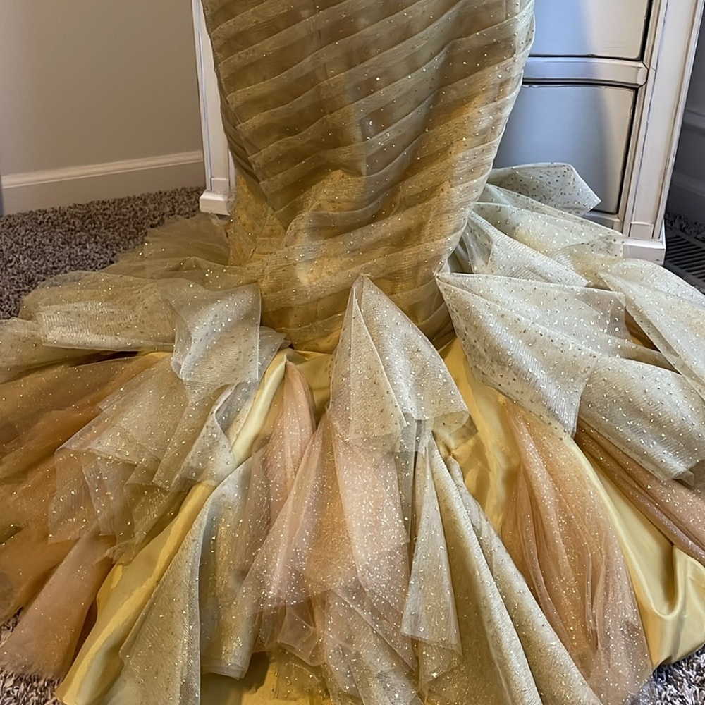 Gold strapless mermaid-style formal gown with a ruffled tulle skirting - Picture 6 of 11